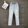 AMIRI White Ribbed Patch Distressed Slim‑Fit Denim Jeans